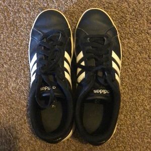 Black adidas shoes.